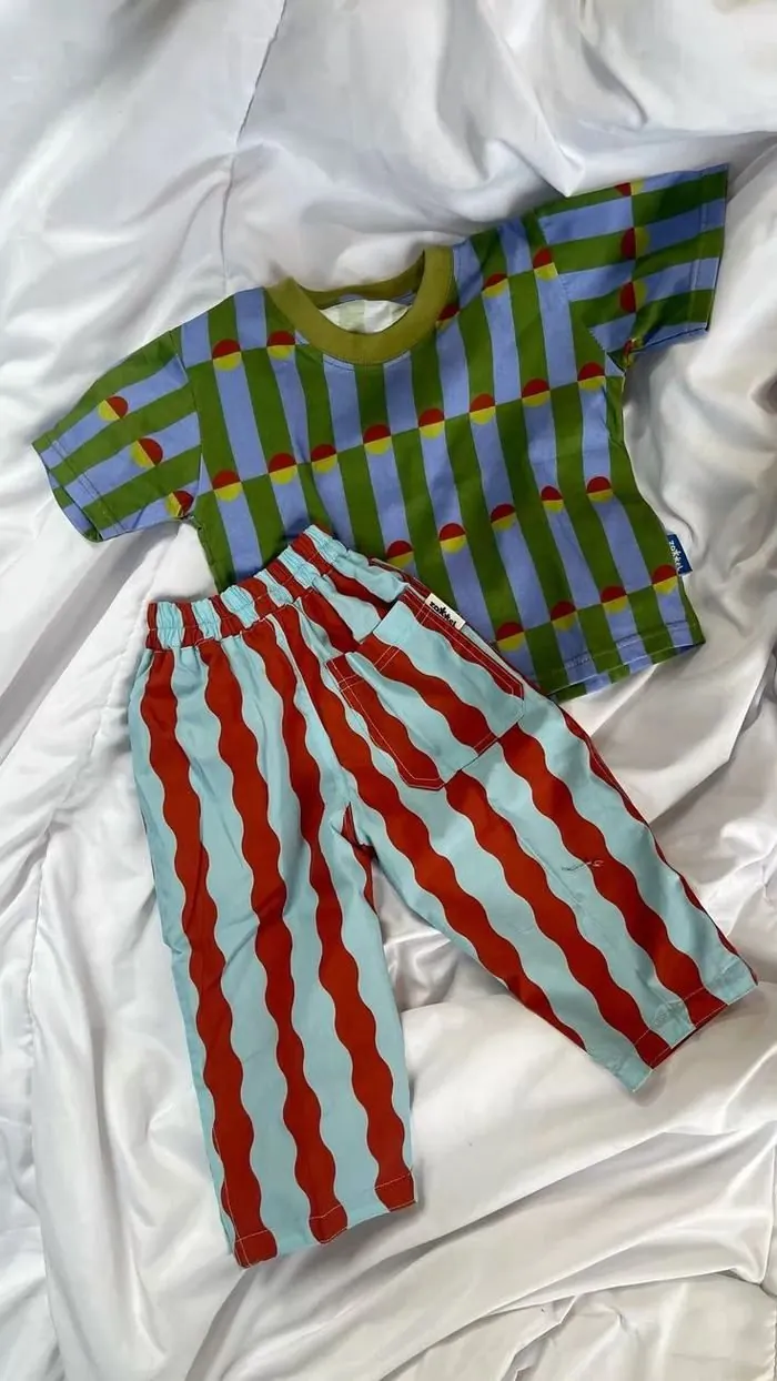 Original product photo of the striped kids outfit taken on a phone